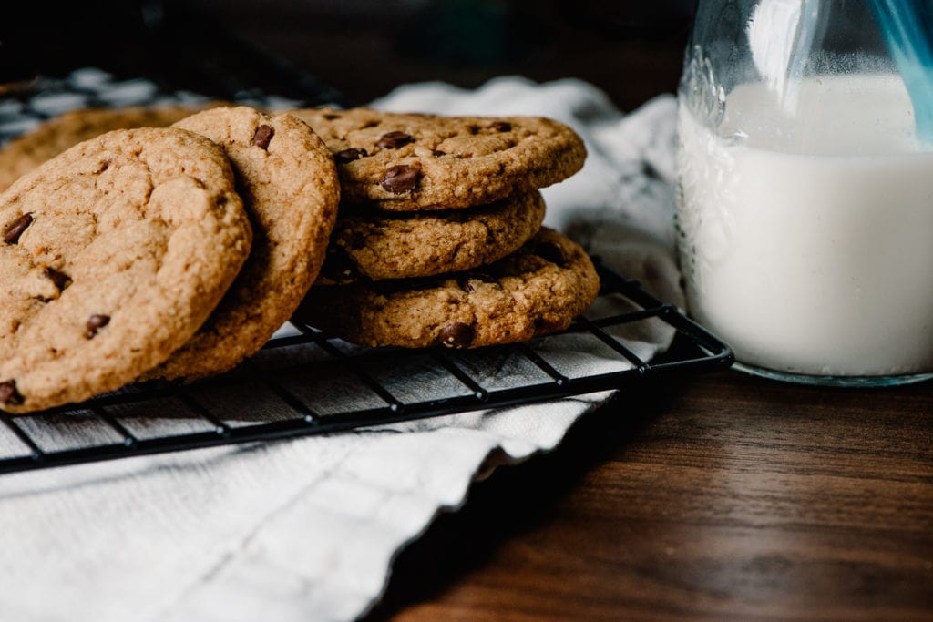 best vegan grain free chocolate chip cookies on a tray with milk in the background