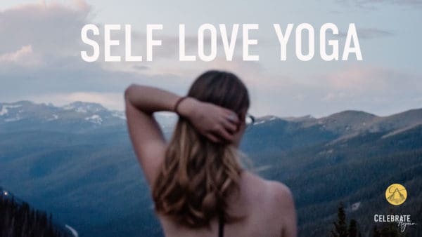"self love yoga" view of female pulling her hair back over looking mountains after the sunset