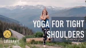 "yoga for tight shoulders 10 minute flow" a photo of emmy doing eagle pose on the top of a mountain