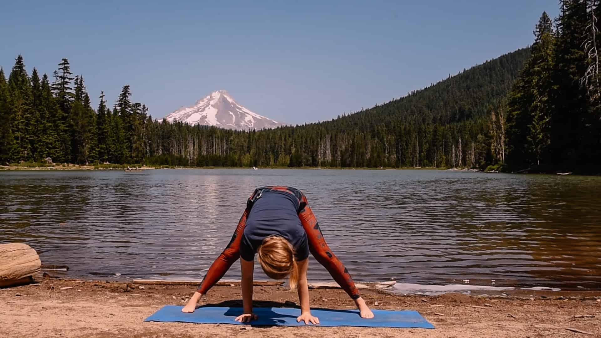 Emmy doing open a folded near an alpine lake for yoga to feel your best