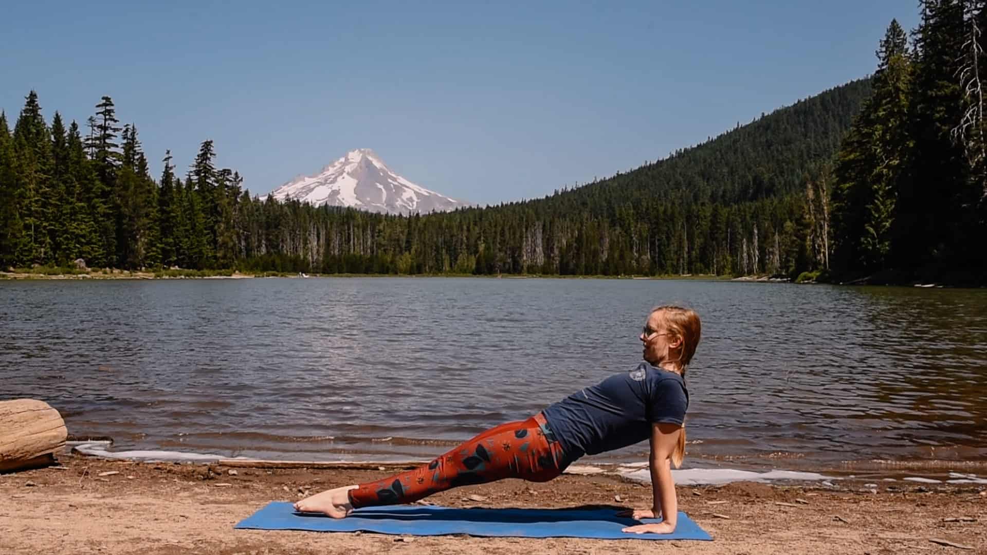 Emmy doing reverse plank near an alpine lake for yoga to feel your best