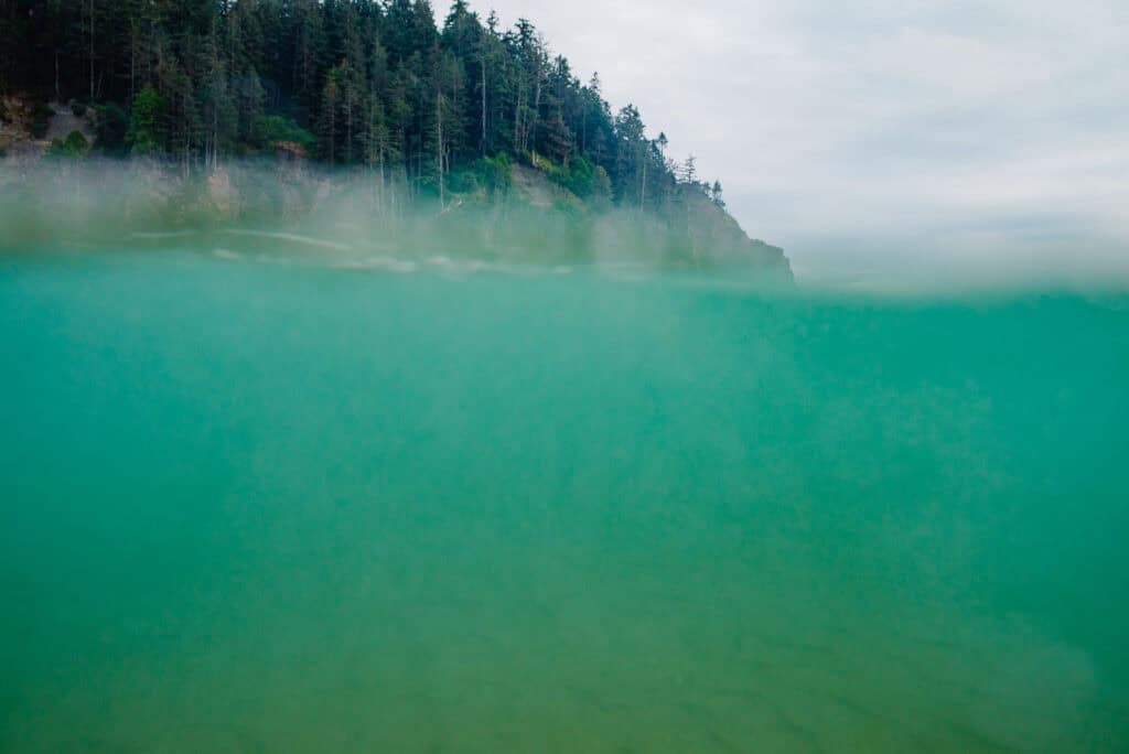 under water with cliff in background