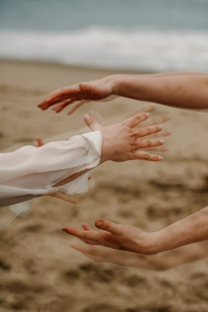 hands together near the sand free somatic exercises
