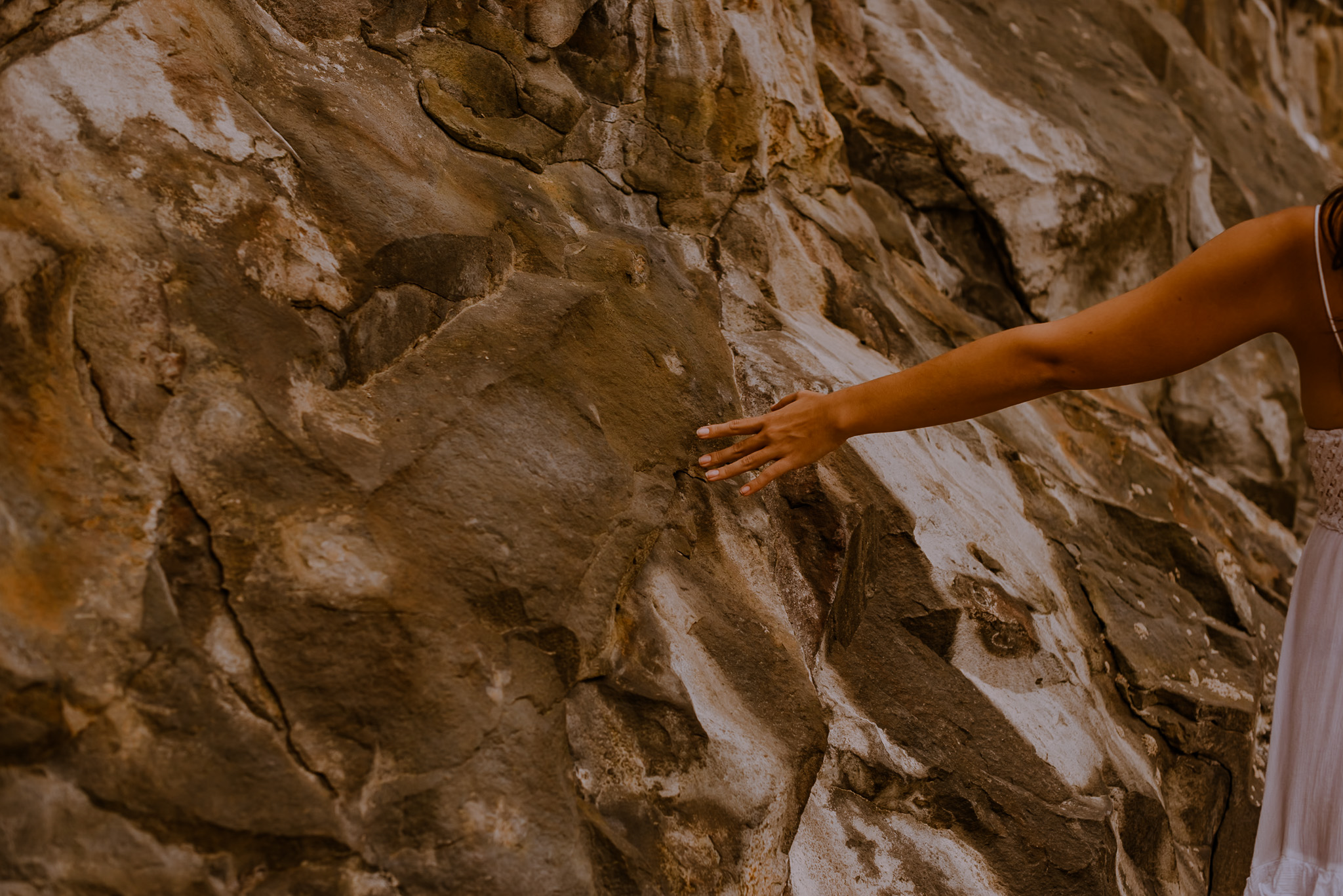 hands on a rock during a free somatic exercises