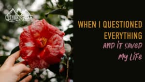 "when you question everything and it saved my life" over photo of a cameallia and hand reaching out